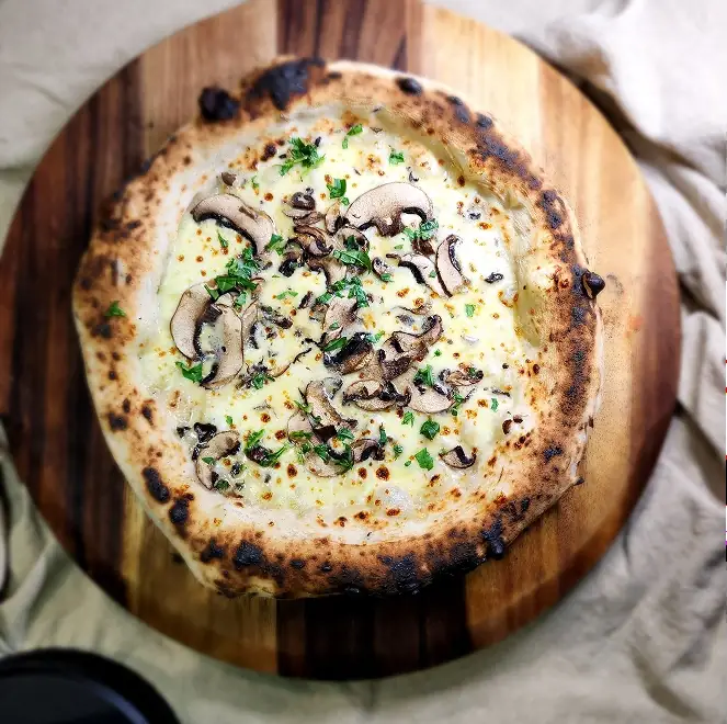 SR Pizza pizza with onion, olive, and mushroom toppings