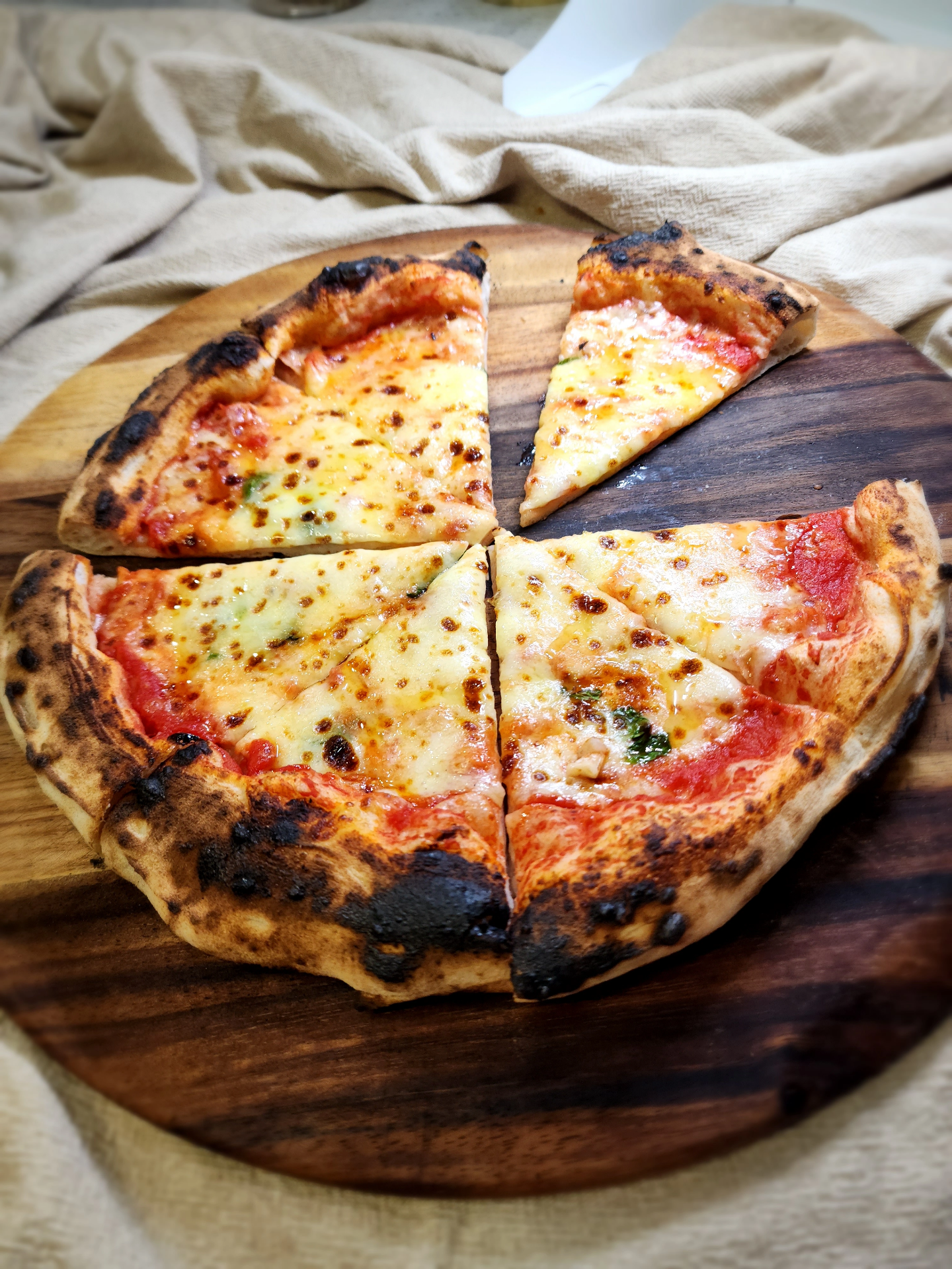 SR Pizza pizza with sliced sausage and sauce drizzle