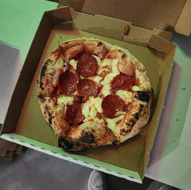SR Pizza pepperoni pizza fresh from the oven in a takeaway box
